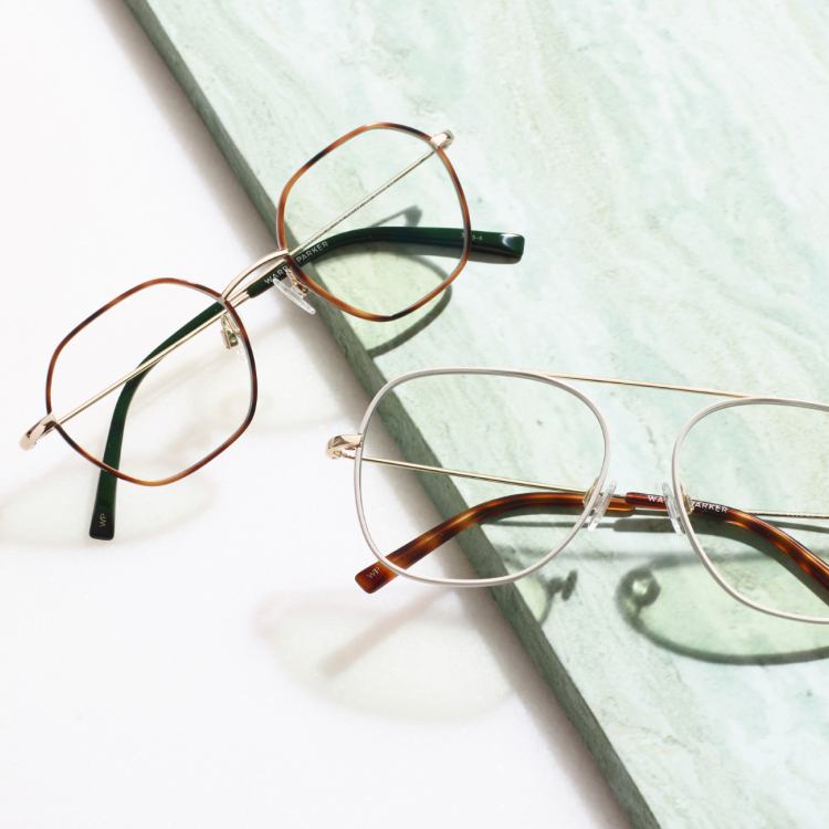 Two pairs of eyeglasses in thin metal frames