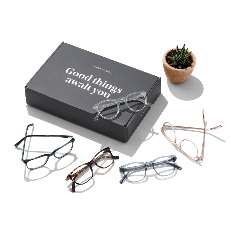 Eyeglasses laid out on a Home Try-On box