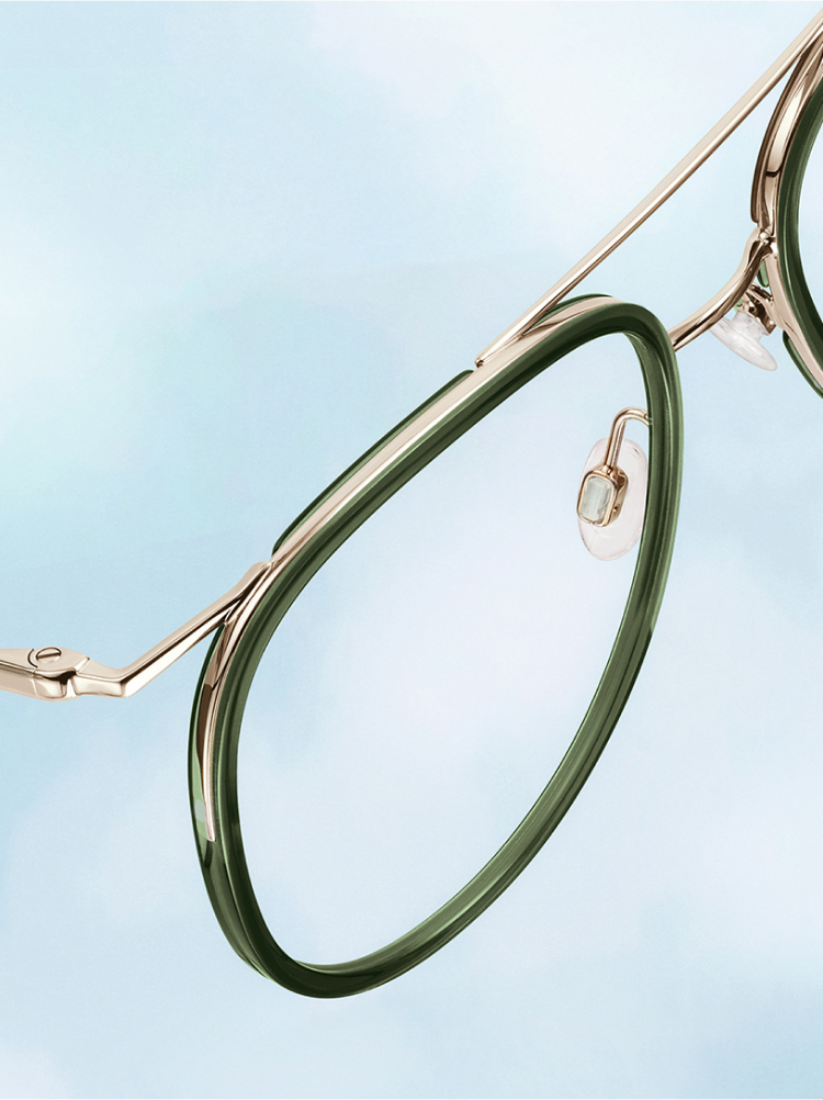 Green and Gold glasses on a blue sky background.