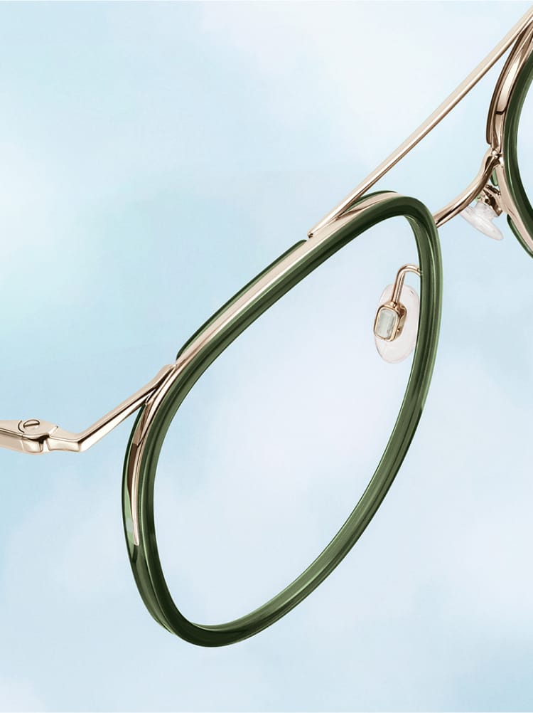 Green and Gold glasses on a blue sky background.