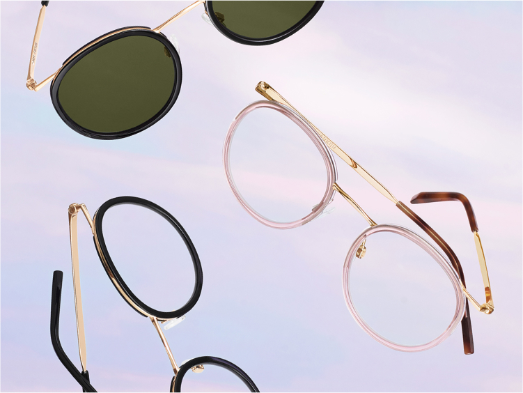 Three frames closed up with a sky background. One sunglass and 2 eyeglasses.