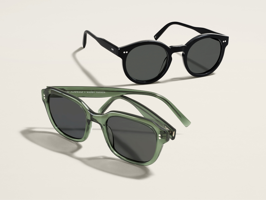 One sunglasses in green acetate and one sunglasses in black acetate