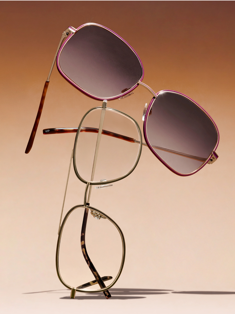 Glasses on top of another, on a brown background.