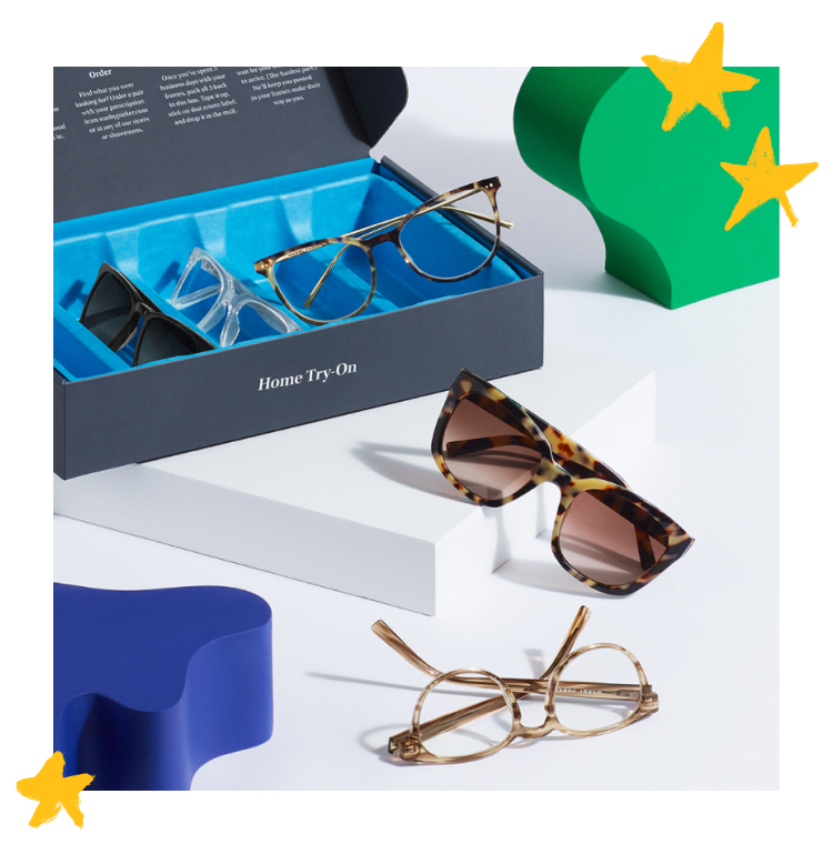 A Warby Parker Home Try-On box with three pairs of eyeglasses and two pairs of sunglasses.