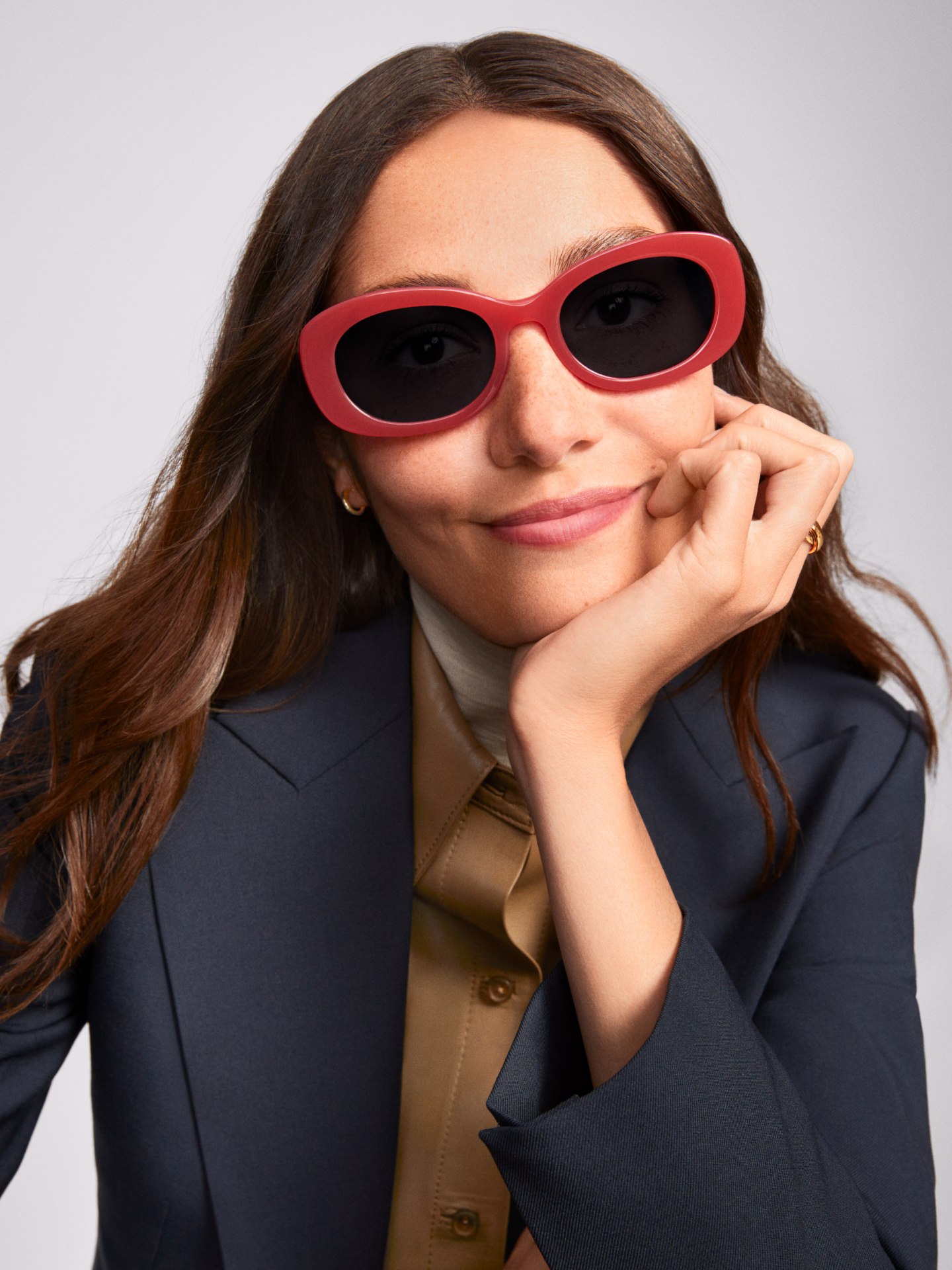 Model wears the Carmel frame in Strawberry Rhubarb.