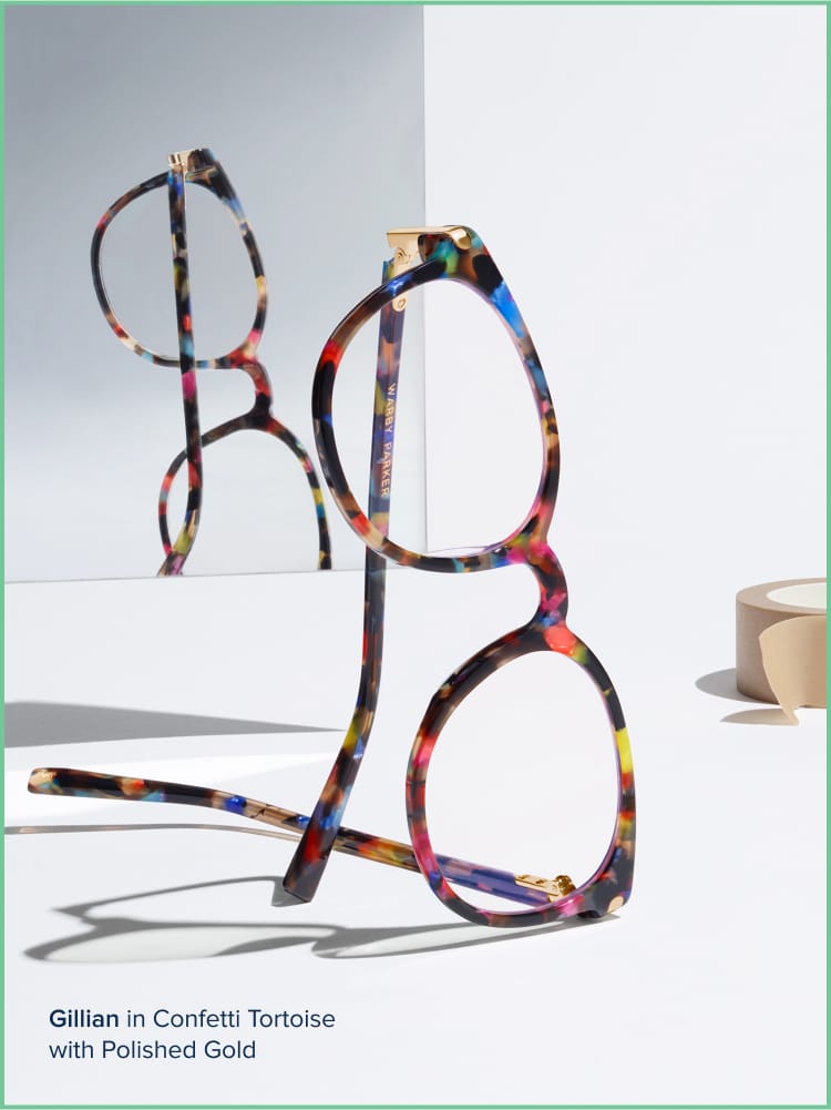 Multicolor frames against a neutral background and a mirror.