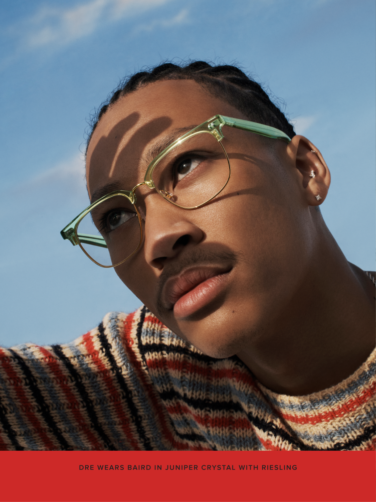 Lil Dre wears the Baird frame in Juniper Crystal with Riesling.