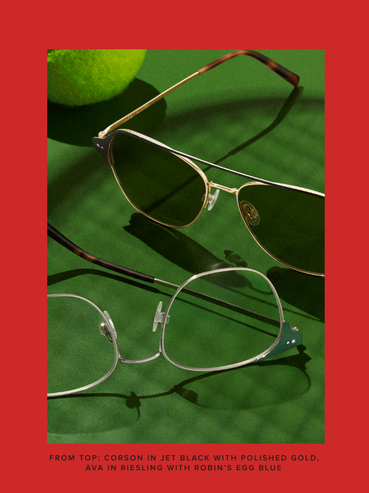 Two pairs of glasses on green surface with a tennis ball. Text: "Corson in Jet Black with Polished Gold, Ava in Riesling with Robin's Egg Blue."