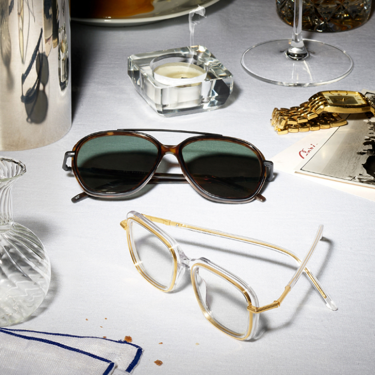Aviator sunglasses and oversized eyeglasses on table