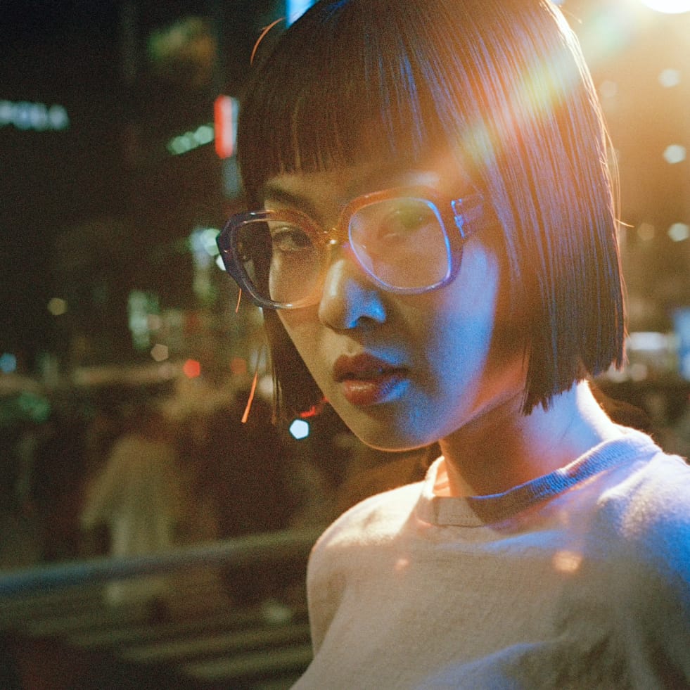 Model wears the Gilda frame in Lido Crystal Fade