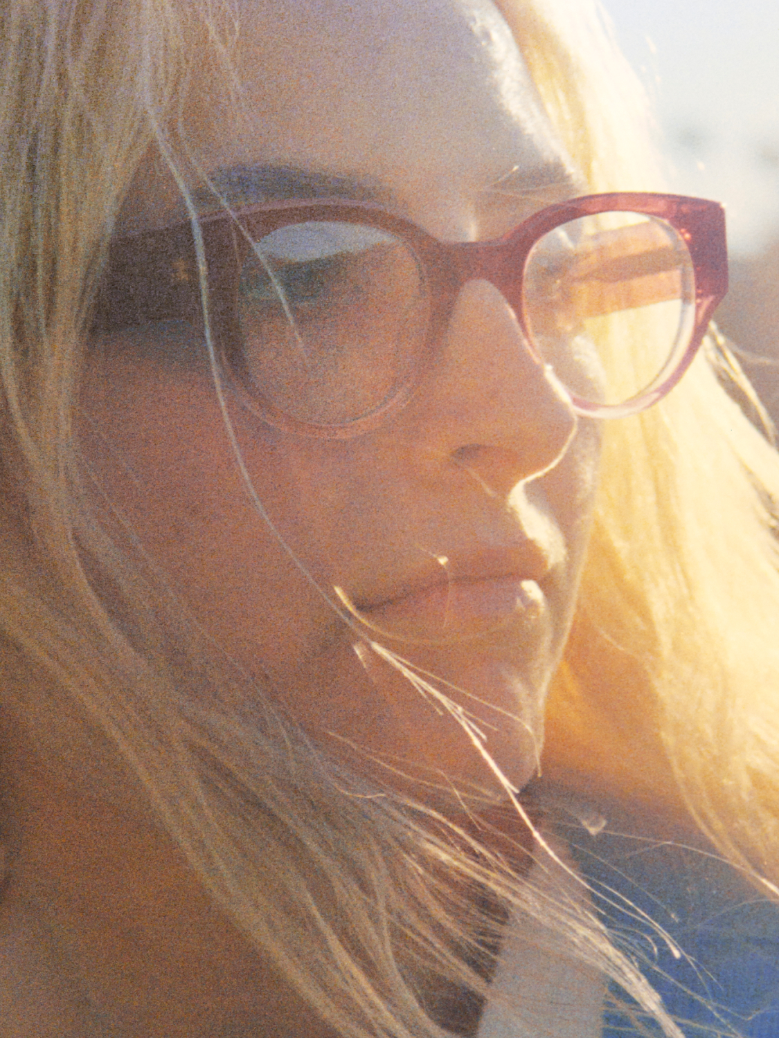 Model wears the Leti frame in Elderberry Crystal Fade