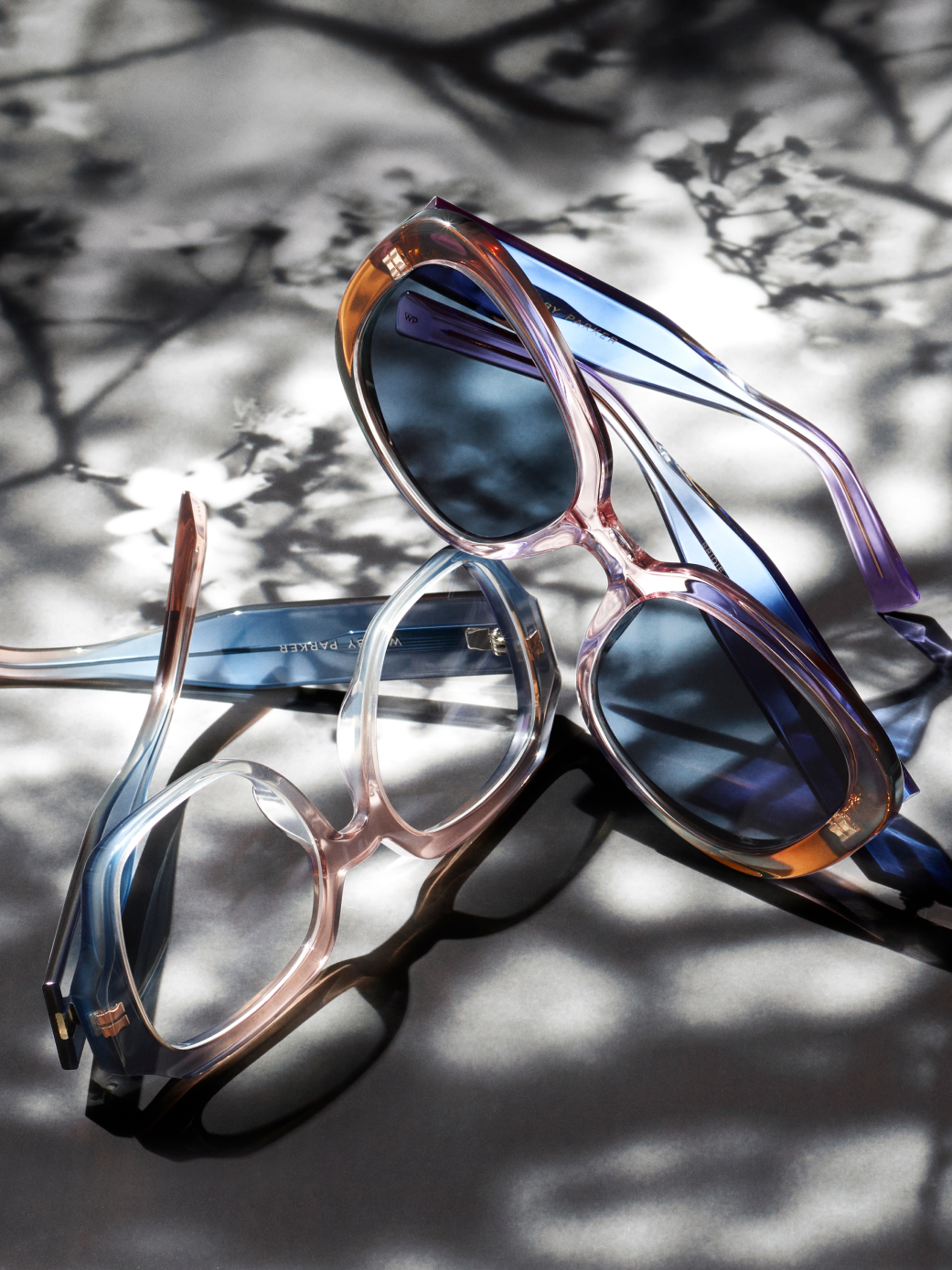 The Bridie frame in Hyacinth Crystal Fade and the Gilda frame in Lido Crystal Fade