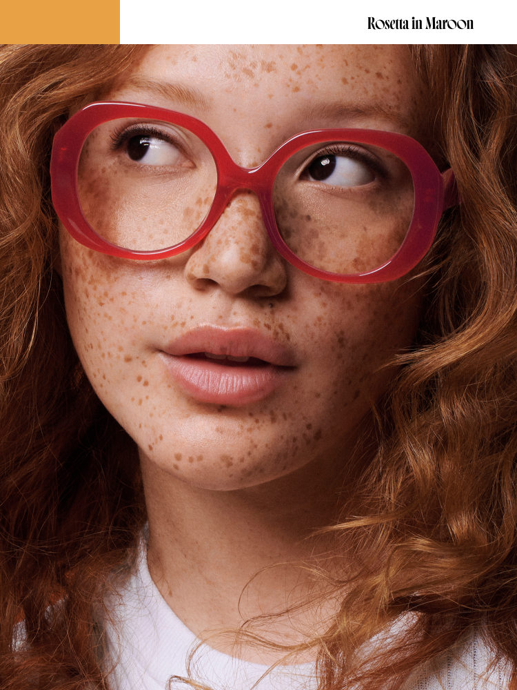 Model wears the Rosetta frame in Maroon.