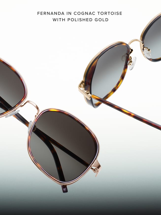 Close-up image of sunglasses with a chic, geometric frame. The frame is in a cognac tortoise pattern with polished gold accents. The dark lenses add a stylish contrast. The background is a light gradient, highlighting the sunglasses. Text above reads, "Fernanda in Cognac Tortoise with Polished Gold."