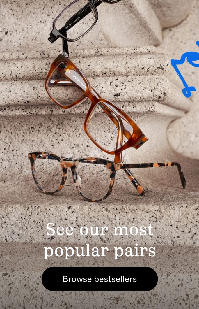 Stack of three pairs of eyeglasses against a blue background. Text reads: "See our most popular pairs. Browse bestsellers."