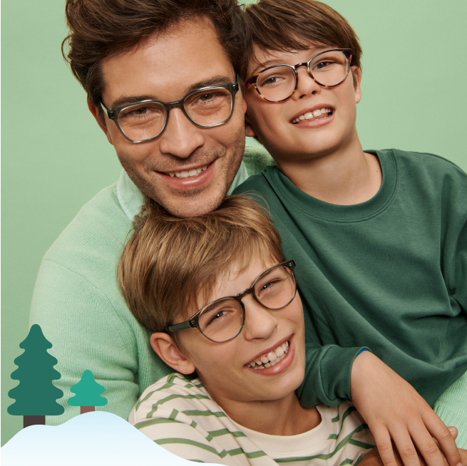 Man and two children all of them wearing green and glasses