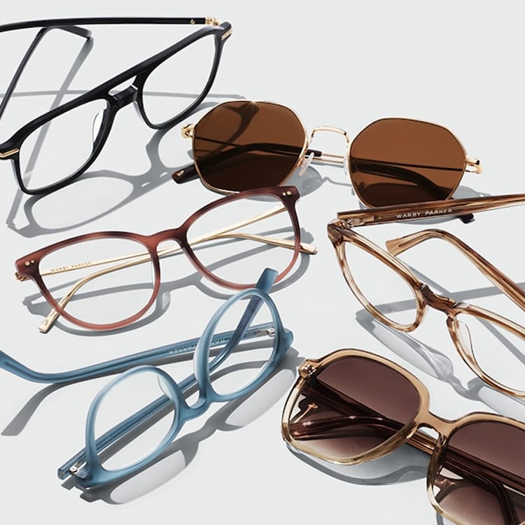 Six pairs of eyeglasses and sunglasses in various colors and styles on a white background.