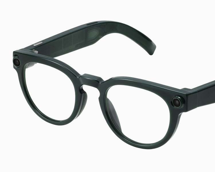 Black-framed glasses with round lenses and thick arms, on a white background.