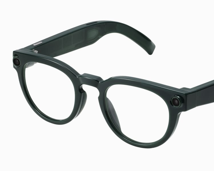 Black-framed glasses with round lenses and thick arms, on a white background.