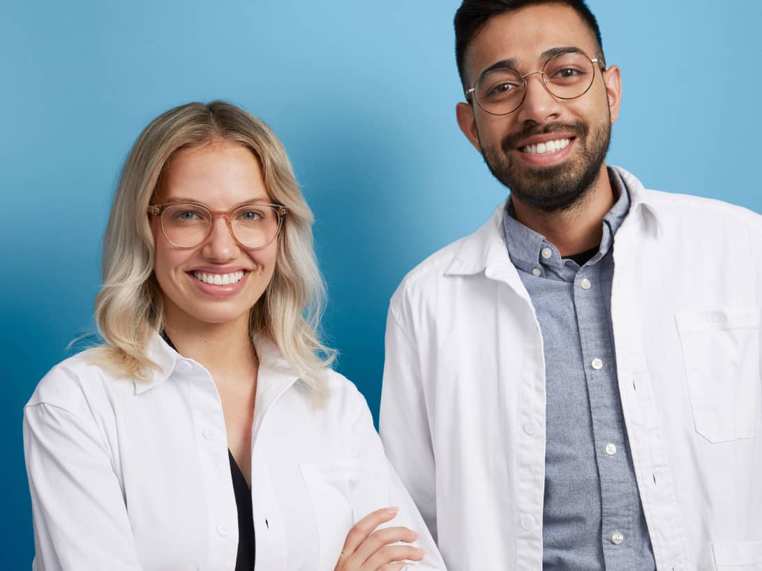 Best-in-class female and male optometrists smiling