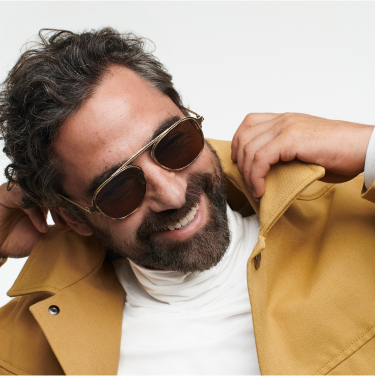 man wearing warby parker foldable metal sunglasses frames.
