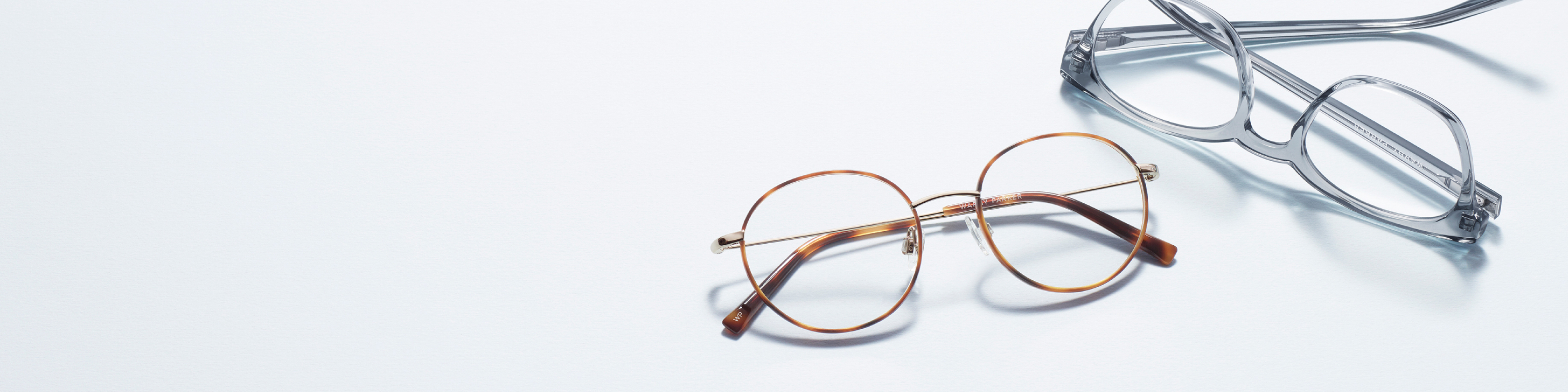Round gold metal and gray acetate eyeglass frames