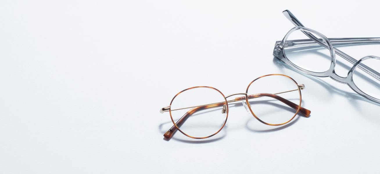 Round gold metal and gray acetate eyeglass frames