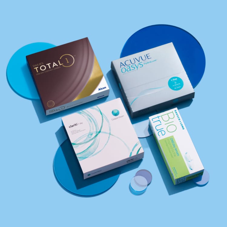 Boxes of contact lenses—Dailies Total1, Acuvue Oasys, Clariti, and BioTrue—arranged on a light blue background.