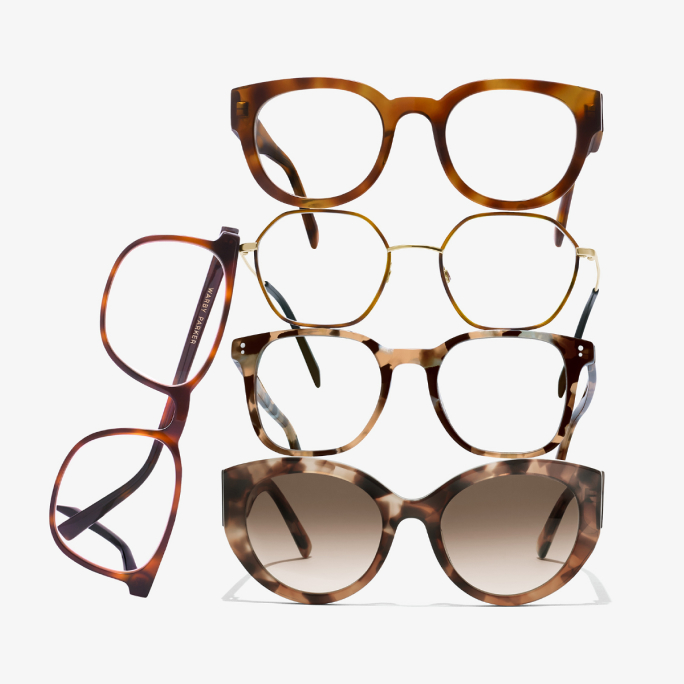 Two pairs of eyeglasses, one with clear frames and the other with tortoiseshell frames, displayed against a light blue background.