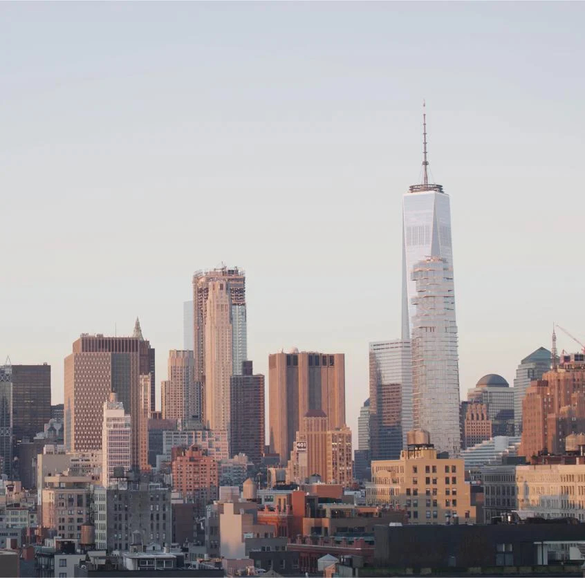 New York City cityscape at sunset.
