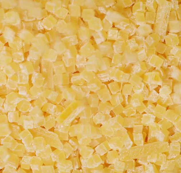 Hundreds of square yellow acetate pieces in a pile. 