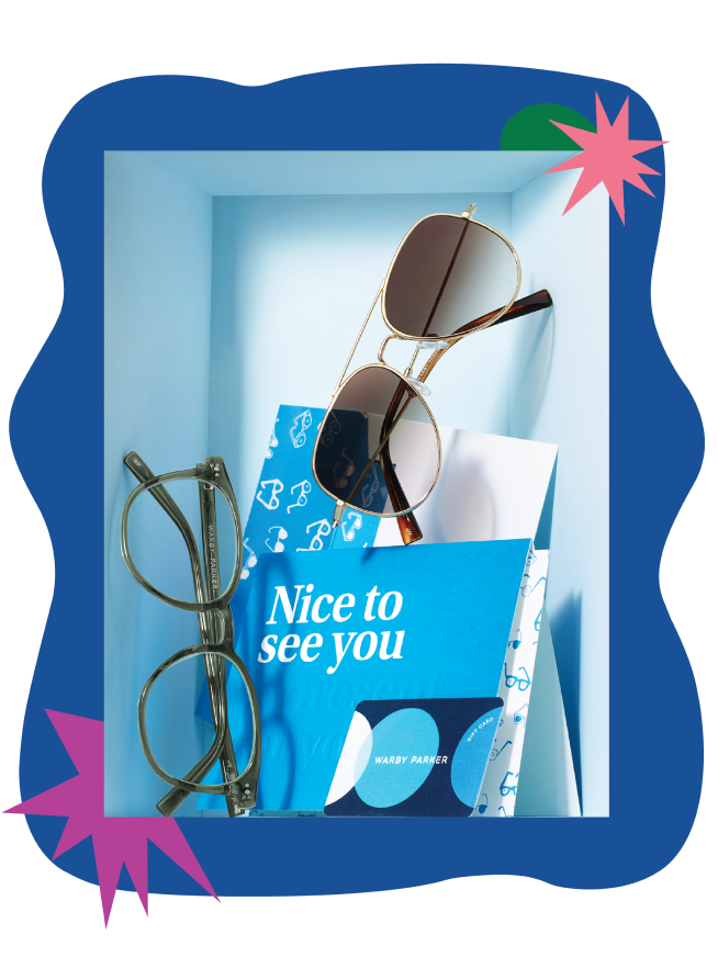 Gift set of glasses on a blue box inside a digital photo frame.