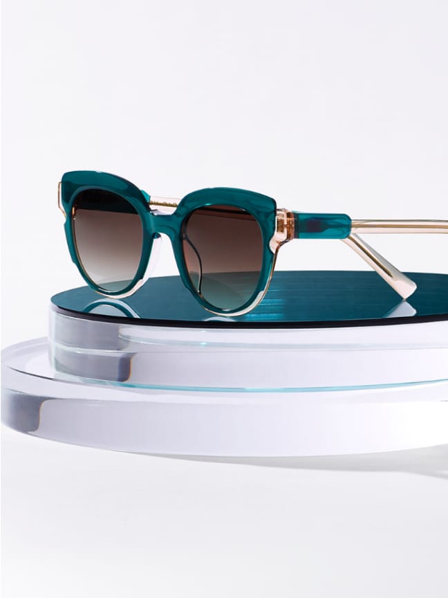 Frames resting on top of a layered crystal.