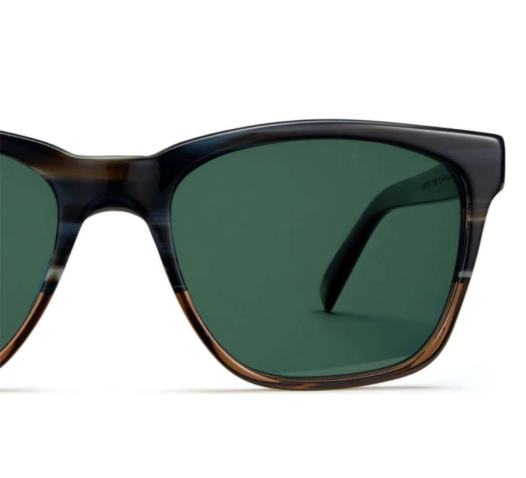 Half of a square acetate Barkley in Antique Shale Fade frame with solid green polarized lenses.