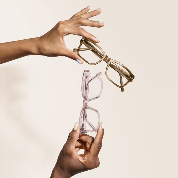 Hands holding glasses.