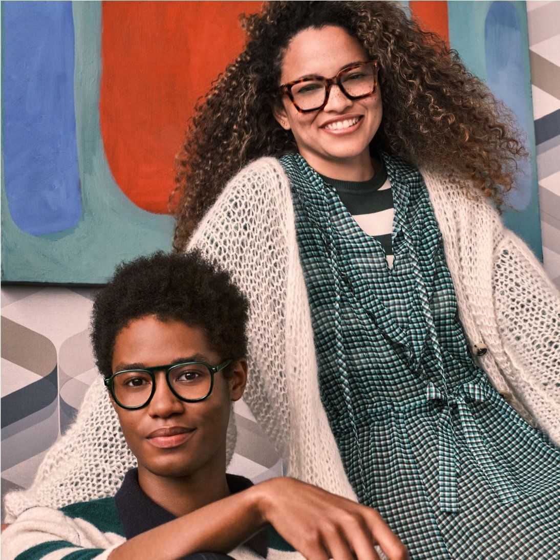 People posing with glasses.
