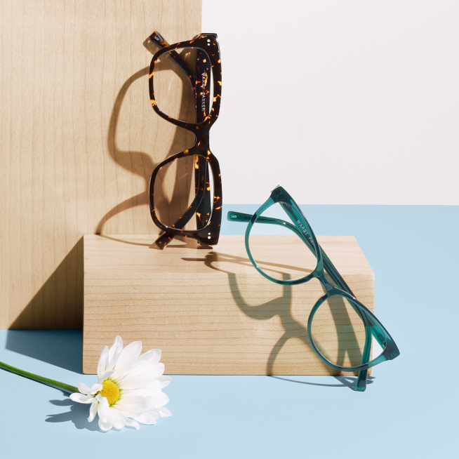 Glasses frames on top of wood.