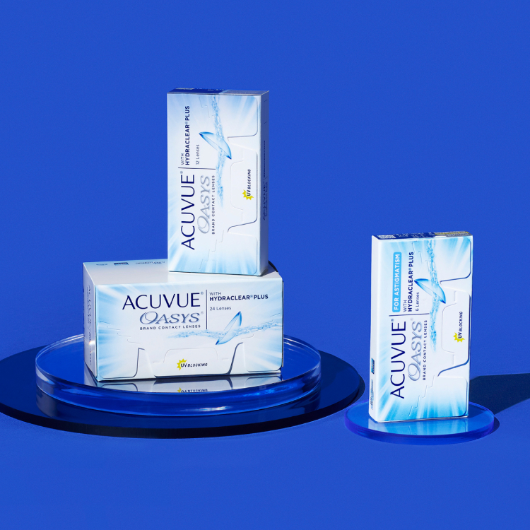 Acuvue contacts over a glass plate in a blue background.