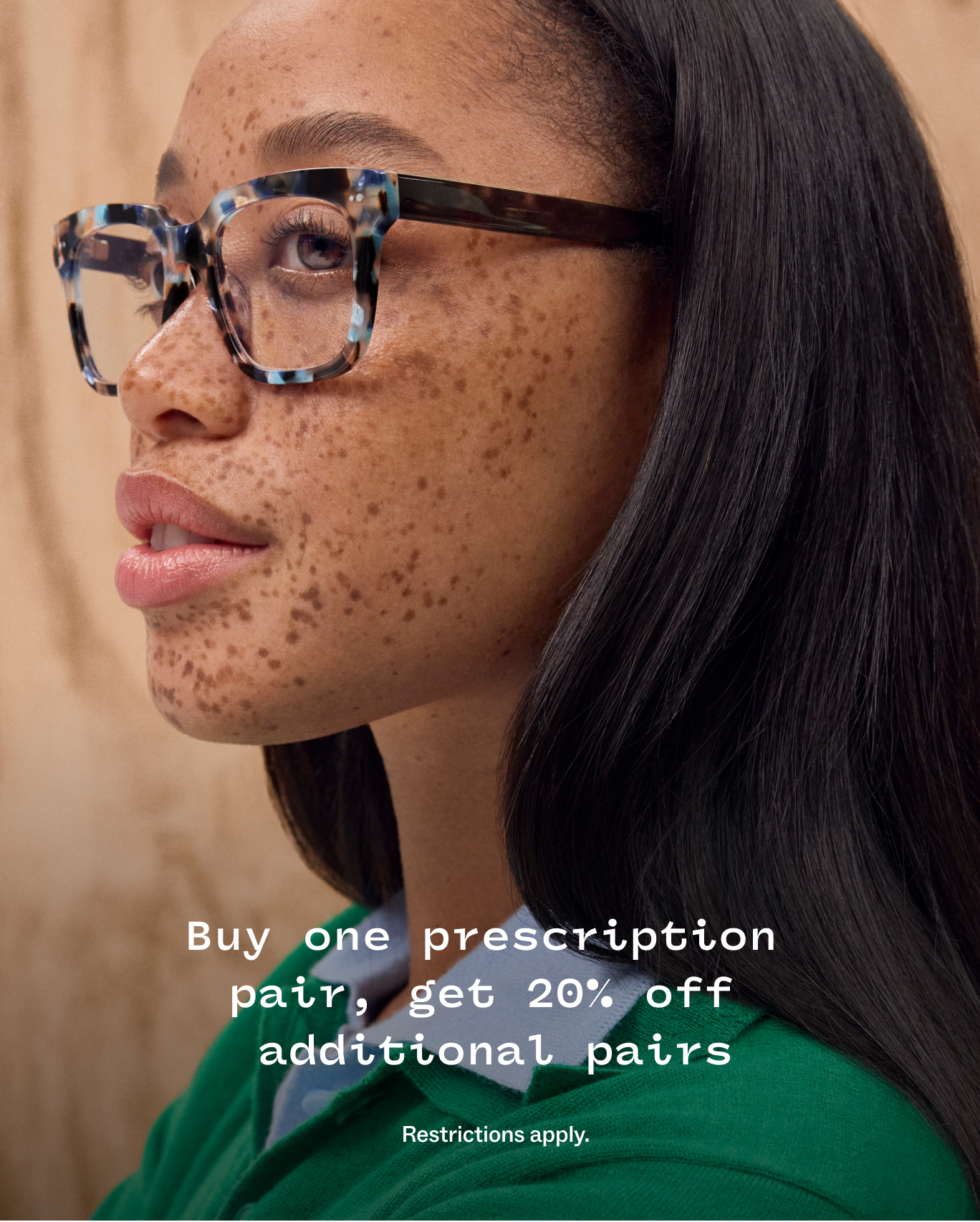 15% off two or more prescription pairs. Save more with your FSA. Woman wearing glasses nearby.