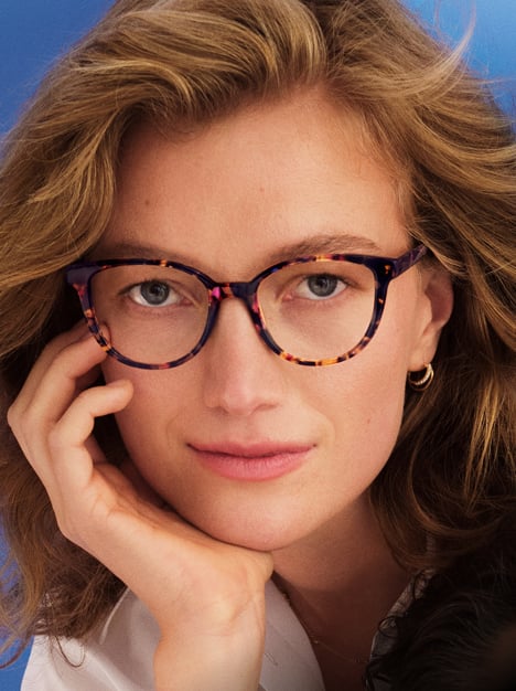 Person wearing tortoiseshell cateye glasses