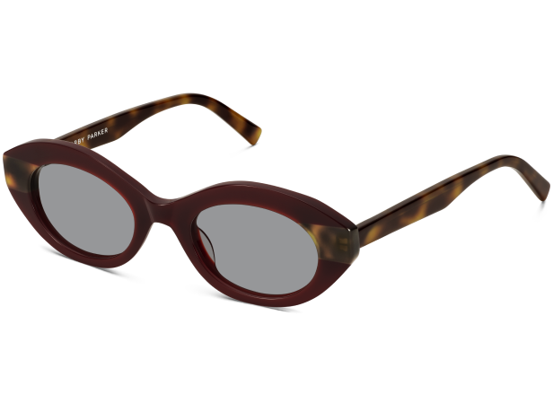 Maroon cat-eye sunglasses with tortoise shell arms and gray lenses.