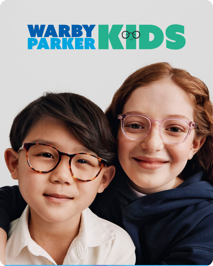 Two smiling kids wearing glasses — one in tortoiseshell frames, the other in light pink ones.