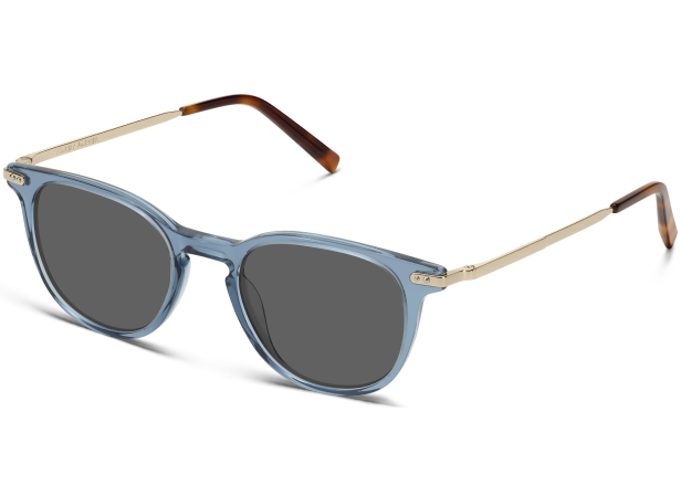 Colorful floral patterned sunglasses with dark lenses and "Warby Parker" branding on frame.