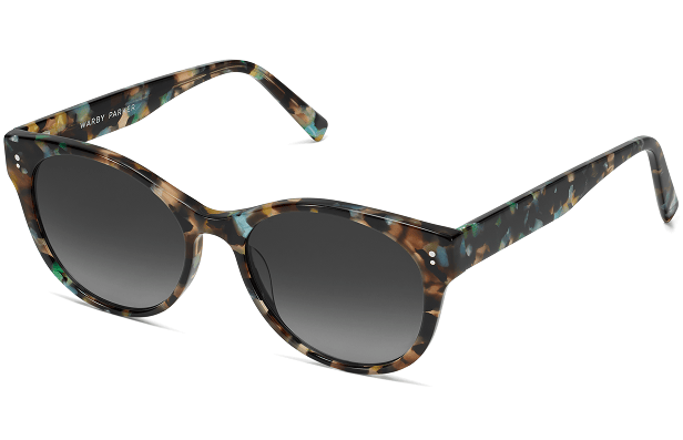 Colorful tortoiseshell patterned sunglasses with dark gradient lenses.