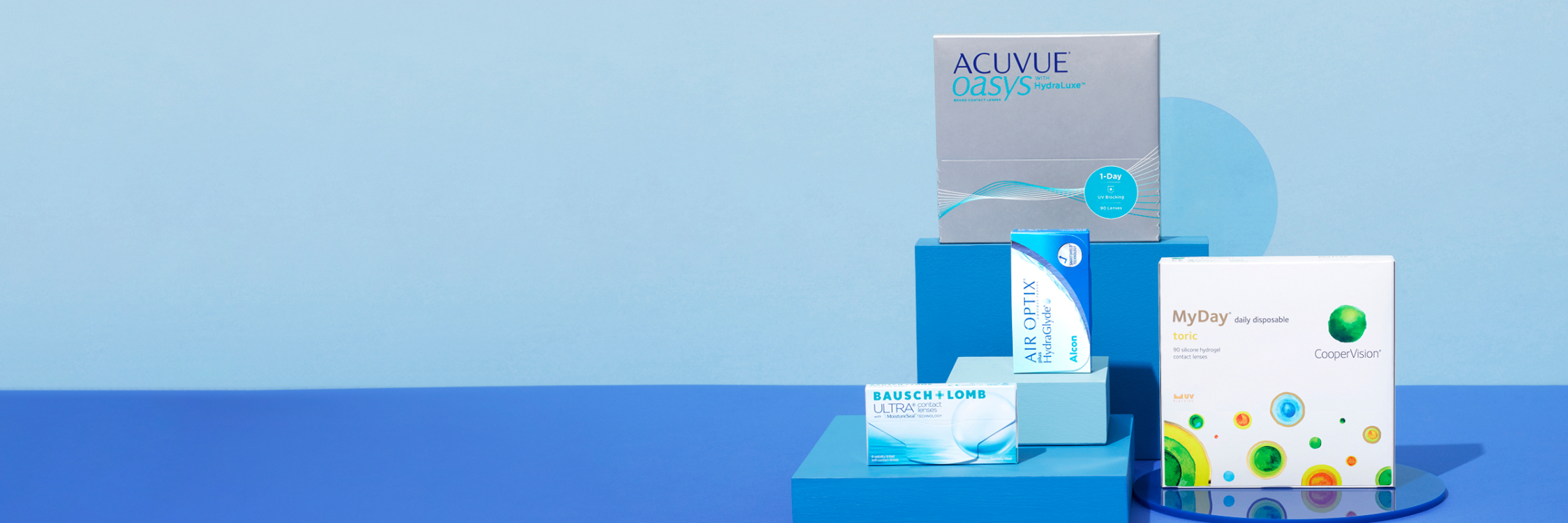 Five contact lens boxes on blue platforms against a light blue background.