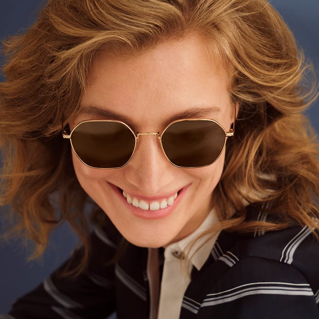 stack of bestselling prescription sunglasses in square, round, aviator, and cateye shapes