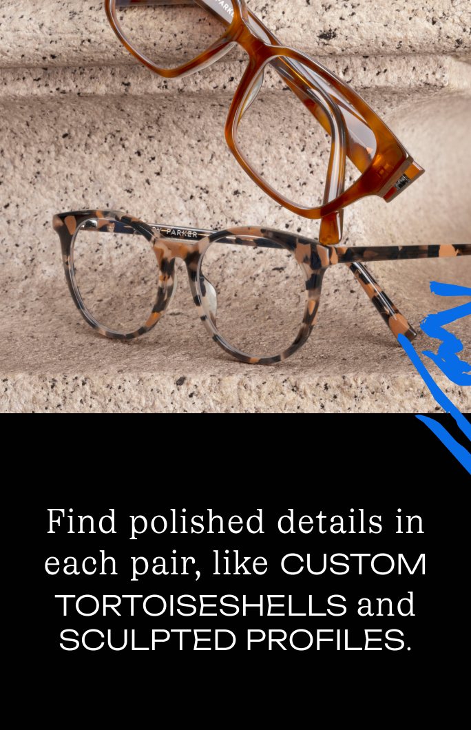 Close-up of three pairs of glasses with tortoiseshell patterns on a textured surface.