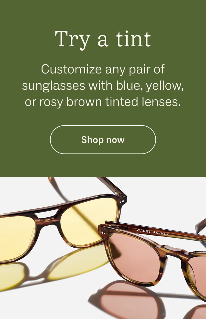 Two pairs of sunglasses, one with yellow lenses and one with rosy brown lenses.