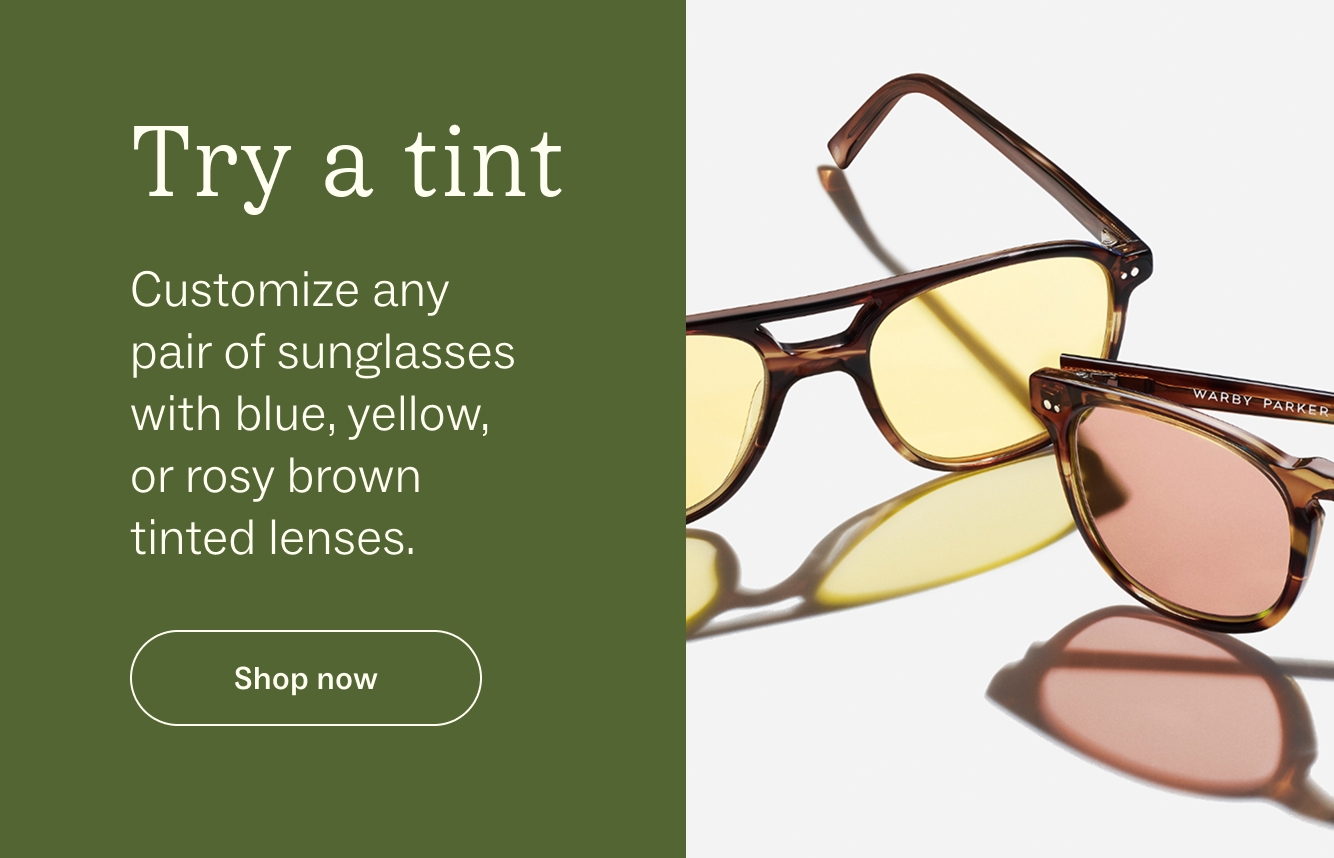 Two pairs of sunglasses with tinted lenses, one yellow and one rosy brown.