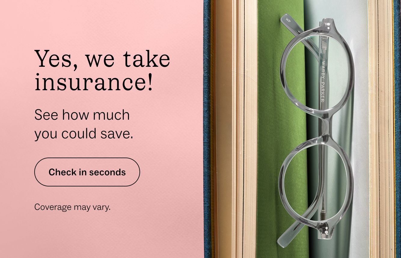 Clear glasses resting on a stack of books with text overlay "Yes, we take insurance!"